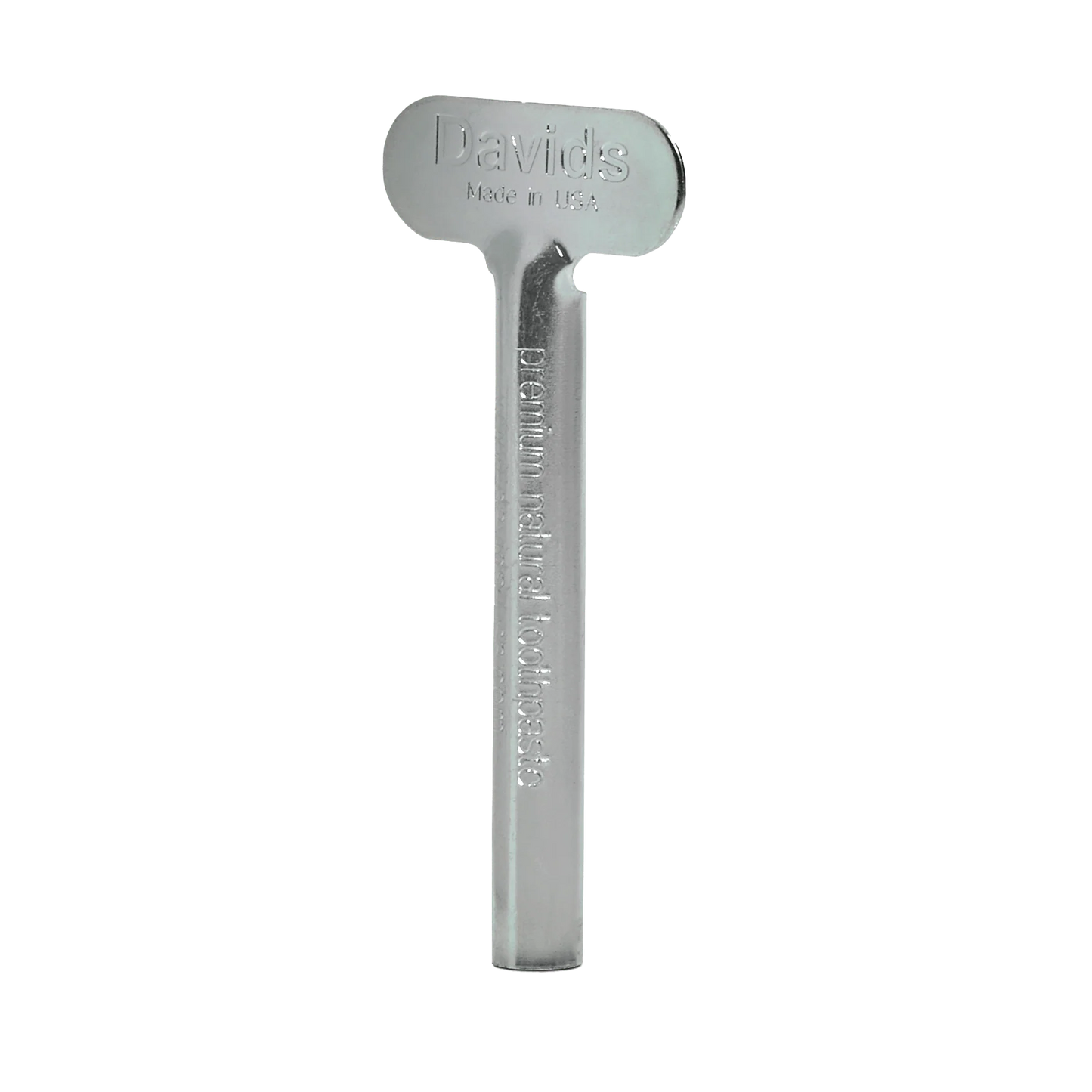 Davids spaustukas metalinėms dantų pastos tūbelėms, be fono.